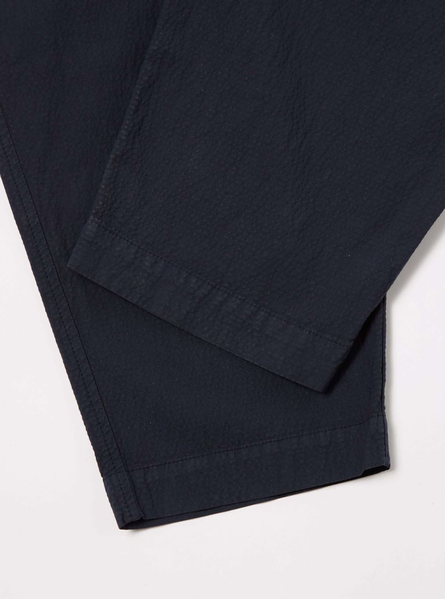 UNIVERSAL WORKS PLEATED TRACK PANT SEERSUCKER II - NAVY