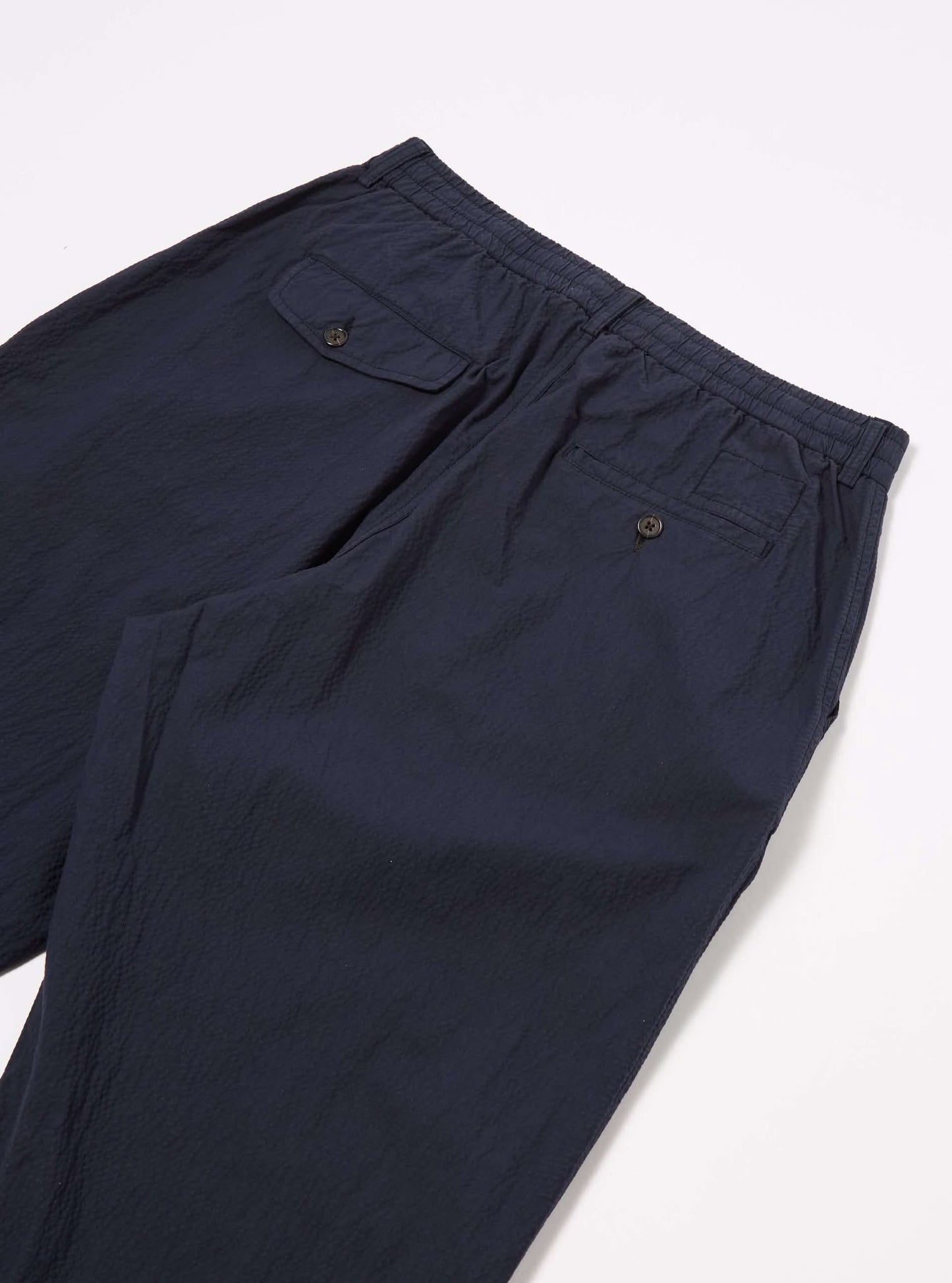 UNIVERSAL WORKS PLEATED TRACK PANT SEERSUCKER II - NAVY