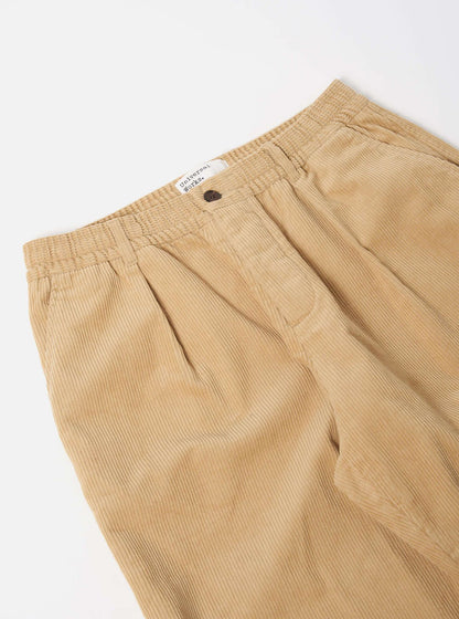 UNIVERSAL WORKS PLEATED TRACK PANT CORD - FAWN