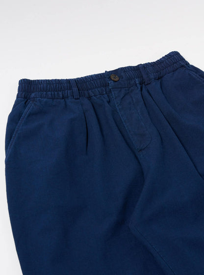 UNIVERSAL WORKS PLEATED TRACK PANT KIMSTOP - INDIGO