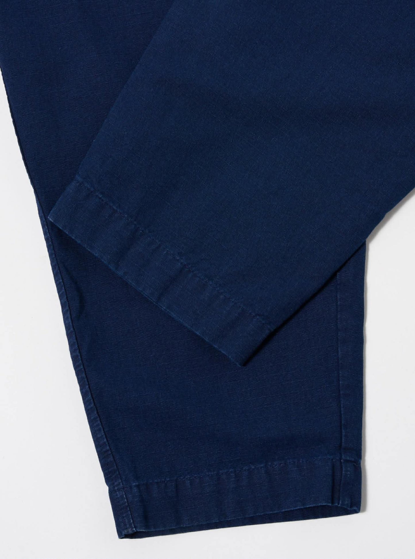 UNIVERSAL WORKS PLEATED TRACK PANT KIMSTOP - INDIGO