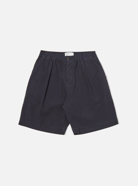 UNIVERSAL WORKS PLEATED TRACK SHORT II SEERSUCKER - NAVY